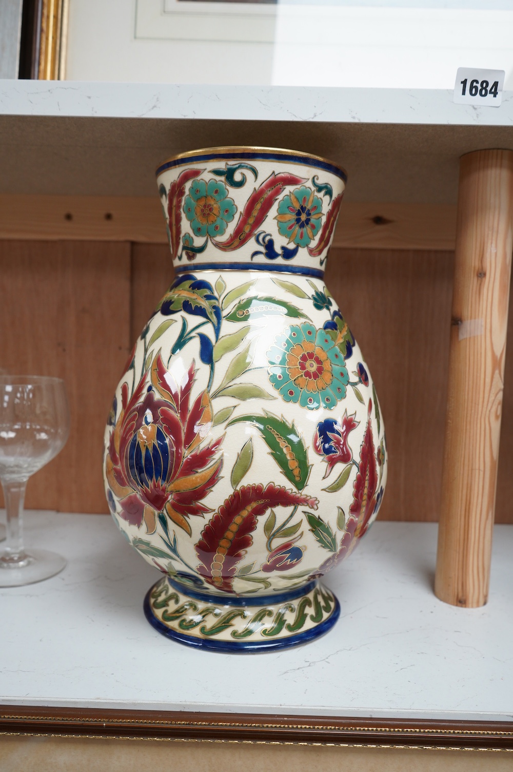 A large Hungarian Zsolnay floral vase, 32cm high. Condition - fair